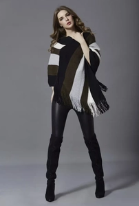 Detailed knit poncho with vibrant colorful stripes and long fringe hem for women
