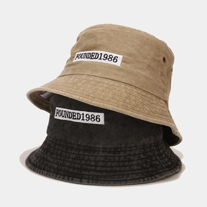 Washed vintage bucket hat in black and khaki with FOUNDED1986 embroidery