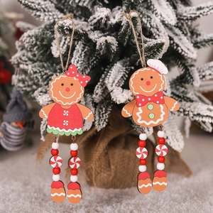 Wooden gingerbread man Christmas tree hanging ornaments with snow and burlap base decor