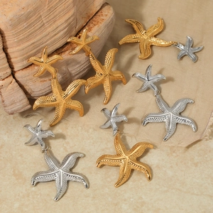Bohemian starfish dangle earrings in gold and silver finish with textured metal details
