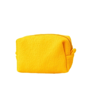 Large yellow bubble textured cosmetic bag with zipper closure and soft quilted fabric