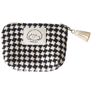 Mini houndstooth plaid coin purse with a beige tassel and happy girl label on white
