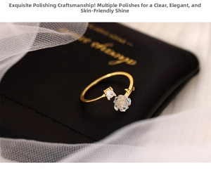 Detailed shot of a gold camellia open ring with white rose and clear cubic zirconia stone