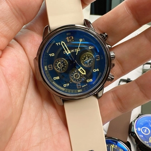 Close-up of DOUKOU quartz watch with blue dial and beige silicone strap for casual wear