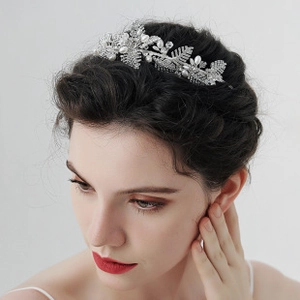 Detail of silver bridal headband with sparkling rhinestones and delicate pearls for women