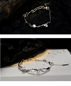 Macro detail of S925 silver pearl bracelet featuring irregular metal charms and glossy beads