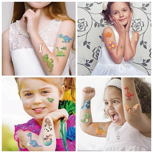 Detailed views of cute colorful cartoon dinosaur tattoos applied on children's arms