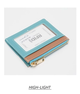 Macro detail of slim RFID blocking wallet showing teal leather texture and gold zipper