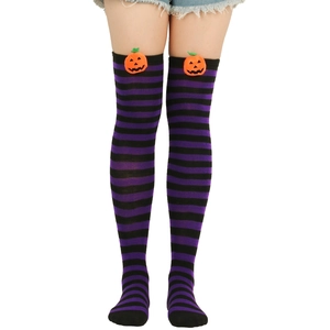 Detail of purple and black striped Halloween over-knee socks with orange pumpkin patch