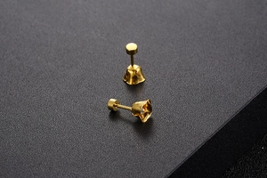 Macro shot of gold plated lily of the valley stud earrings with sparkling cubic zirconia