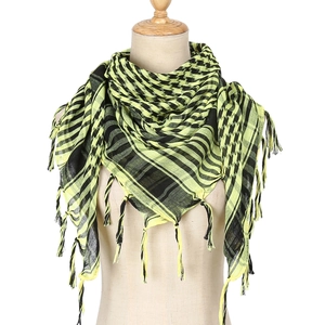 Detail of checkered shemagh scarf featuring fluorescent yellow fringes on a mannequin