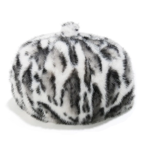 Detailed close-up of leopard print faux mink fur texture on a chic women's beret hat