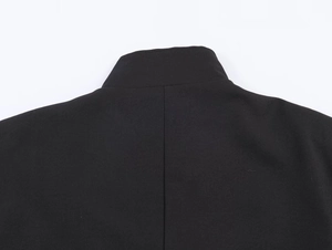 Detail of the high-quality black blazer back collar with fine twill texture and stitching