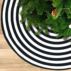 Classic black and white striped Christmas tree skirt with short plush fabric for holiday decor