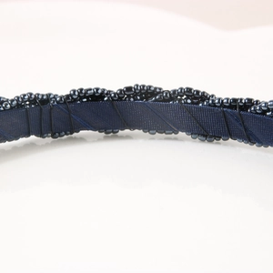 Chic dark blue beaded headband with fabric base and intricate metallic wire details