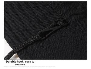 Detail of durable detachable windproof rope hook on black outdoor sun bucket hat