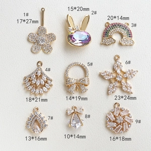 Detailed grid of CZ snowflake rabbit and rainbow pendants with size dimensions