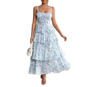 Blue and white floral tiered maxi dress with spaghetti straps and a tiered cake skirt