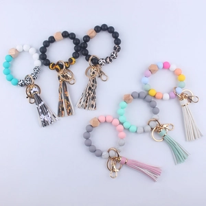 Silicone beaded wristlet keychains with PU leather tassels and natural wood accents