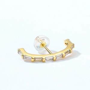 Minimalist gold curved stud earrings featuring five rectangular white zircon stones