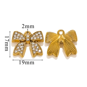 Golden bow-shaped pendant detailed with sparkling rhinestones and clear size measurements