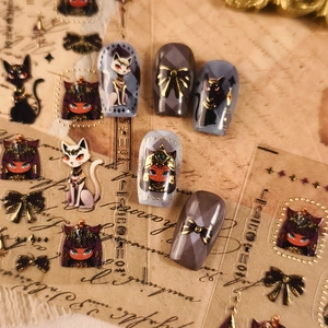 Dark aesthetic Egyptian cat press-on nails with vintage gold goddess stickers