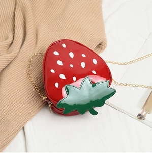 Creative strawberry shaped crossbody bag in red patent leather with gold chain strap