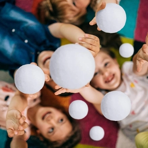 Soft white artificial snowballs for indoor snowball fights and Christmas party decorations
