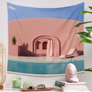 Detail of bohemian tapestry featuring a pink building and pool scene on white wall