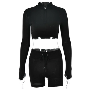 Front view of black long sleeve zip-up crop top and drawstring shorts on a clear mannequin