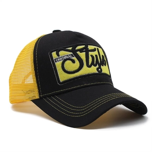 3D embroidered trucker hat with black and yellow mesh panels and curved brim