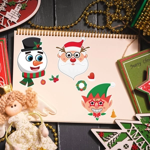 Christmas DIY puzzle stickers with Santa and snowman patterns on a notebook page
