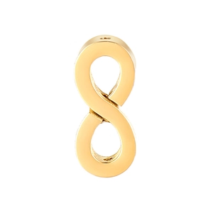 Macro shot of gold infinity symbol beads for DIY jewelry making with metallic shine