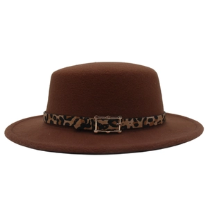 Close-up of leopard print ribbon and gold buckle detail on brown wool felt boater hat