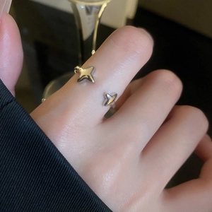 Close-up of silver adjustable star ring with sparkling cubic zirconia on female finger