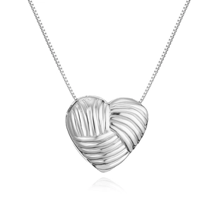 Macro view of silver heart pendant necklace with modern pleated texture on box chain