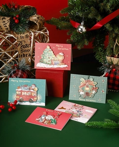Detailed view of 3D Christmas greeting cards with Merry Christmas text on festive background