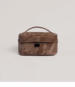 Close-up of a double-layer brown denim texture toiletry bag with sturdy handles