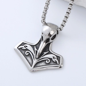 Macro shot of vintage 304 stainless steel Mjolnir raven head pendant necklace detail
