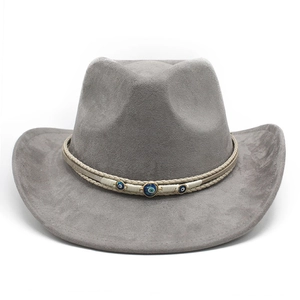 Detail of grey suede fedora featuring evil eye beads on a woven beige band