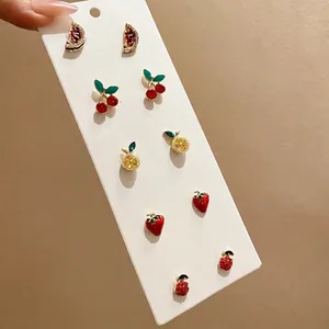 Sparkling fruit earring set featuring 6 pairs of rhinestone watermelon and strawberry studs
