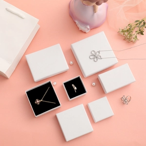 White textured jewelry gift box set with matching paper bag and elegant pearl decor