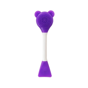 Close-up of double-ended purple silicone facial cleanser brush and flat applicator tip