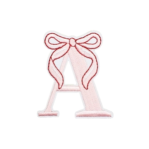Pink embroidered letter A patch with a red bow detail on a white background