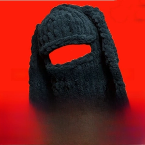 Detail of black knitted bunny ear balaclava hat with soft chenille yarn texture