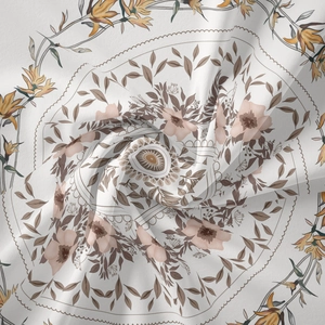 Macro detail showing vintage bohemian floral print on soft light beige tapestry fabric