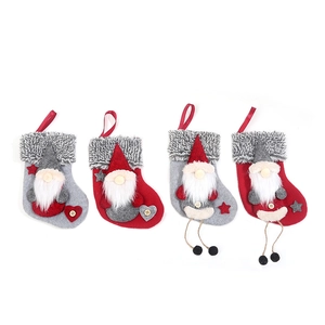 Set of 4 Christmas stockings with red and gray faceless Santa gnomes hanging ornaments