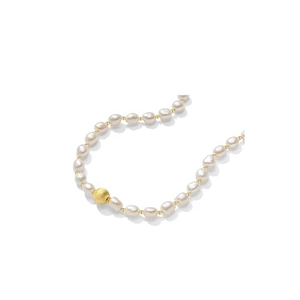 Detail of natural white baroque pearls necklace with a matte gold bead on white background