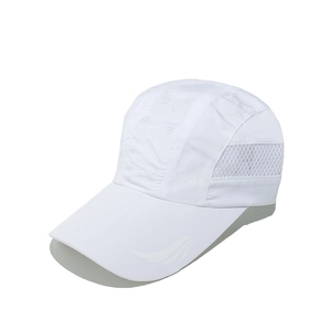 Detail of white quick-dry cap showing breathable mesh panels and laser-cut ventilation