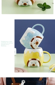 Detail of 3D hedgehog ceramic mugs with textured brick pattern and matching lid and spoon